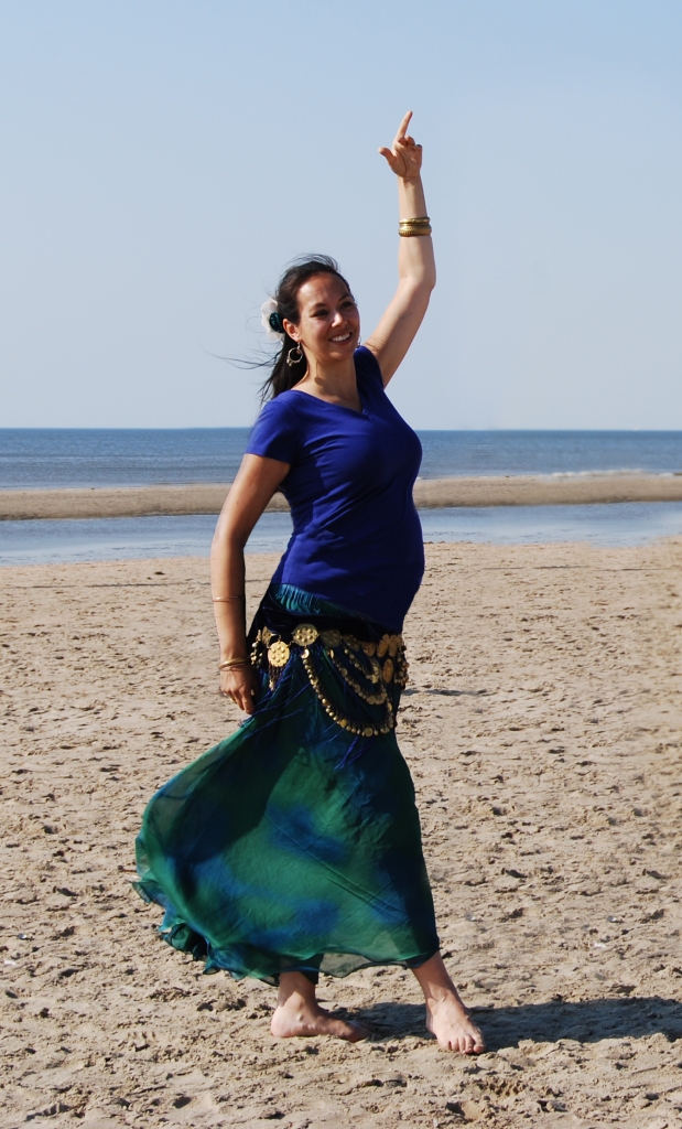 Kyria dancing pregnant on beach
